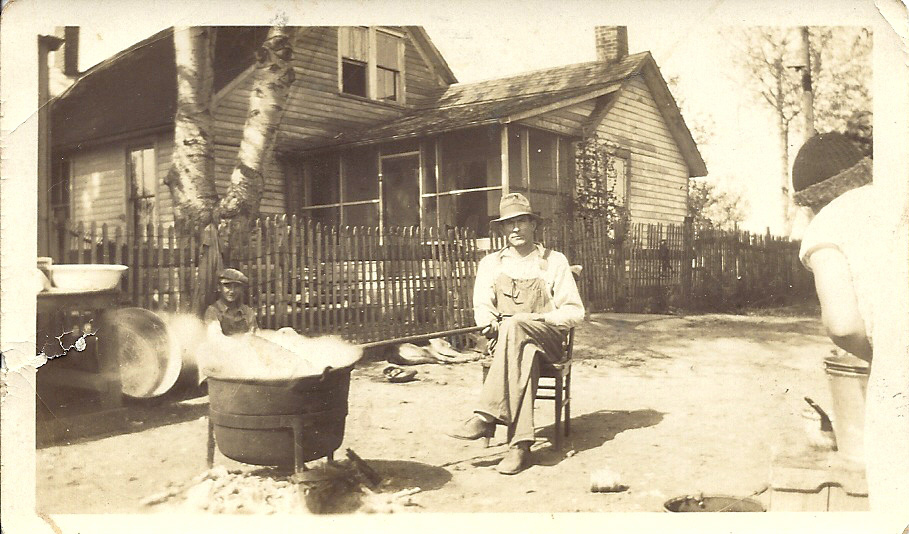 My Great Uncle Vic Fuhrwerk (not my dad but his Uncle, that my dad was named after) stirring the pot of apple butter.  Willard Fuhrwerk, as a young boy, is sitting by the fence.  Willard was my dad's older brother and father to Fran and Barb and grandfather to Cathy Schwartz, leader of the Schwartz clan and her siblings.  The copper pot has been passed down through the family and the Schwartz clan continue to make apple butter in the same pot every fall.   